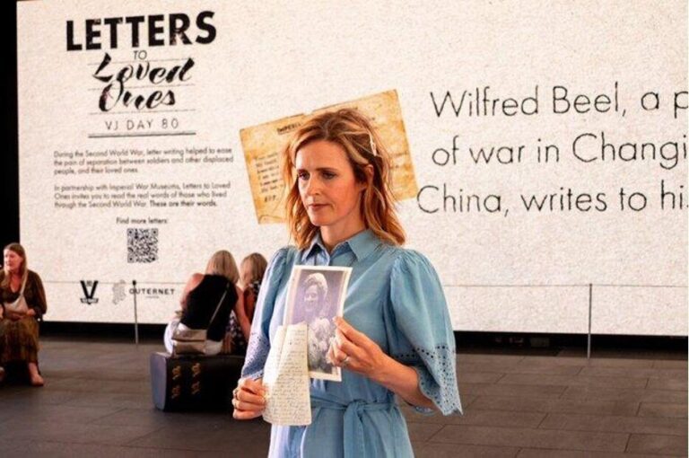 Relative sharing letter at Letters to Loved Ones event, summer 2025