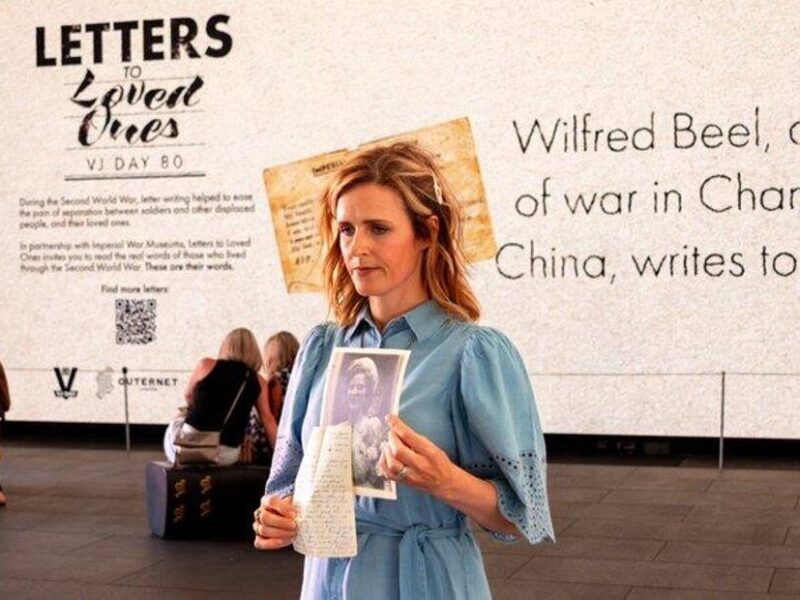 Relative sharing letter at Letters to Loved Ones event, summer 2025